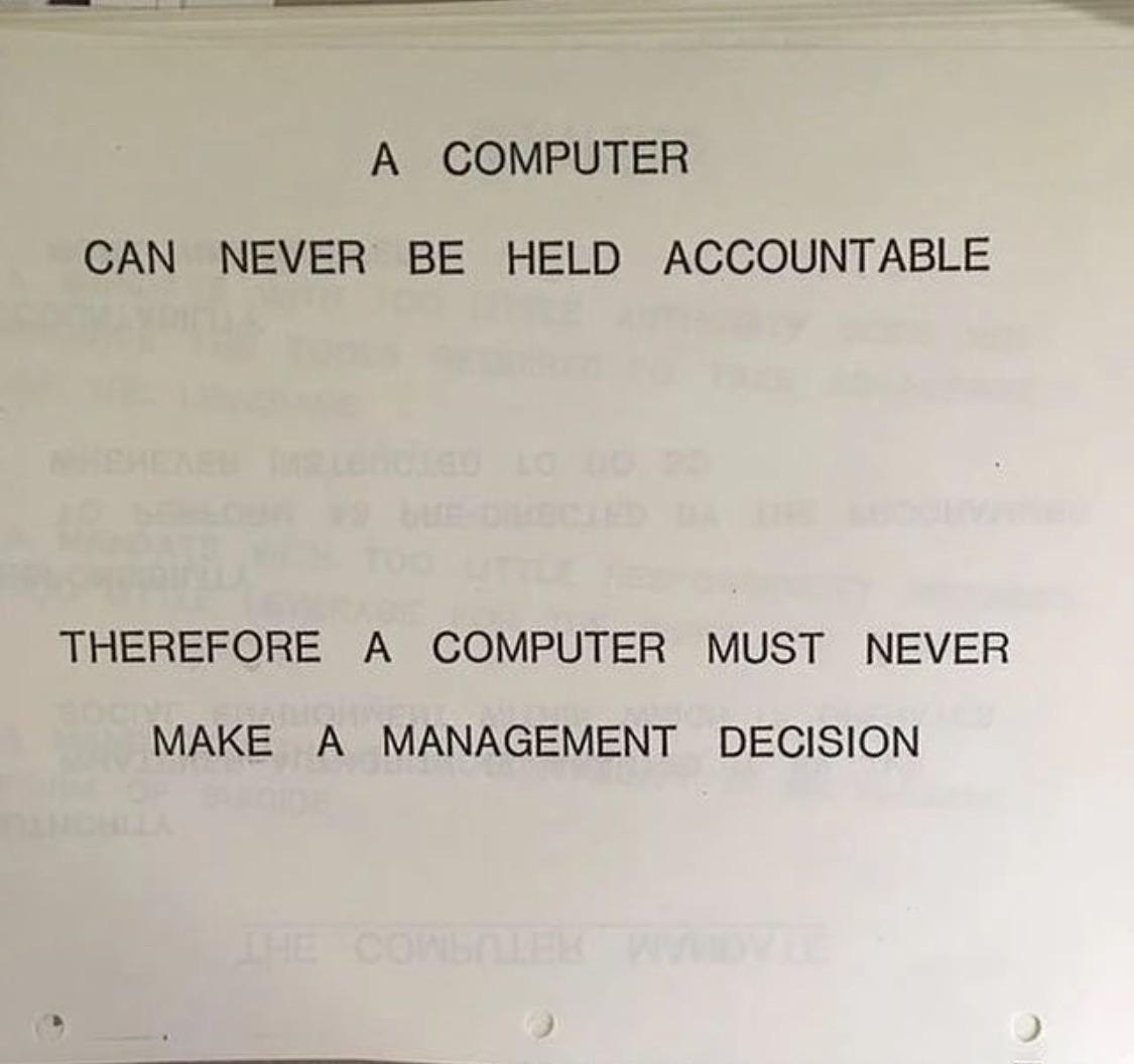 Photograph of a page from an IBM training session, 1979, in capitals: A computer can never be held accountable. Therefore a computer must never make a management decision.